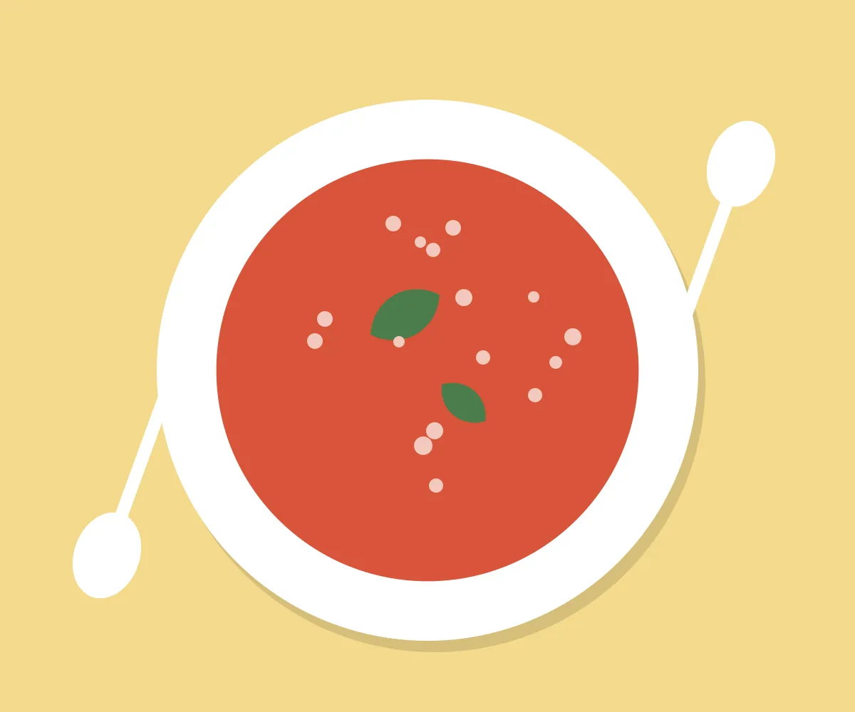 Bowl of tomato soup with basil and spoons